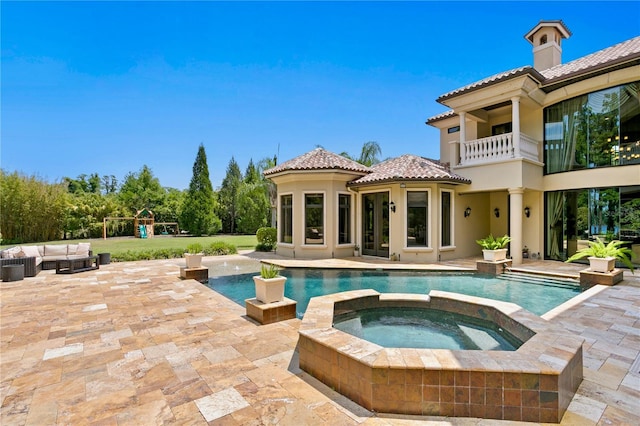 1102 Merry Water Dr, Lutz, FL 33548 - view of swimming pool with a playground, a pool with connected hot tub, an outdoor hangout area, and a patio area