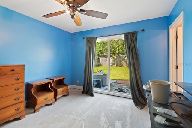 sitting room with a ceiling fan and baseboards