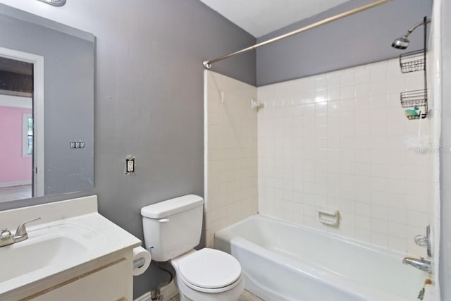 bathroom featuring vanity, toilet, and shower / bathtub combination