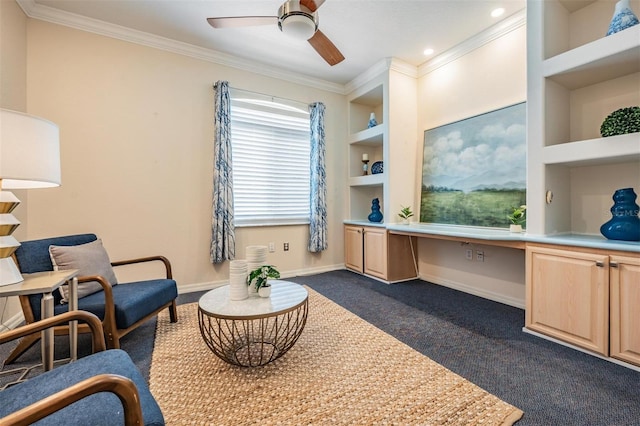 living area with built in features, built in study area, dark colored carpet, baseboards, and ornamental molding