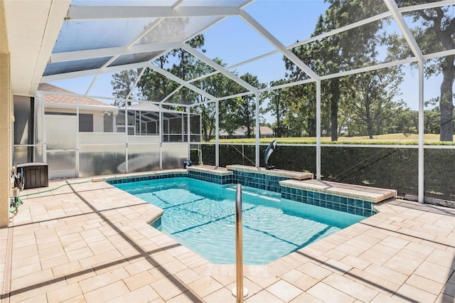 outdoor pool featuring a lanai and a patio area