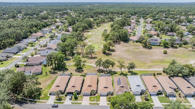 drone / aerial view with a residential view and view of golf course