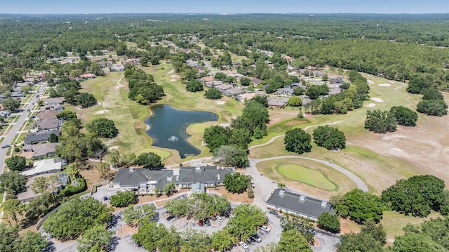 birds eye view of property featuring view of golf course, a water view, and a residential view