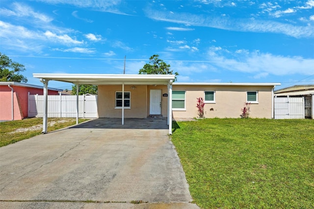 ranch-style house featuring stucco siding, fence, concrete driveway, and a front lawn