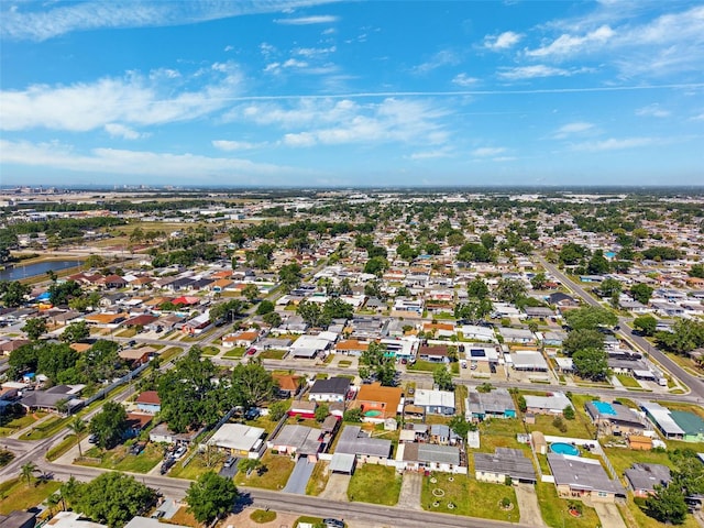 drone / aerial view with a water view and a residential view