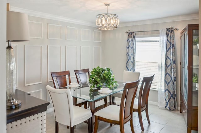 dining space with an inviting chandelier, crown molding, and light tile patterned flooring