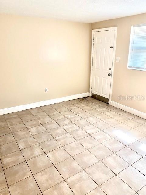 empty room with baseboards