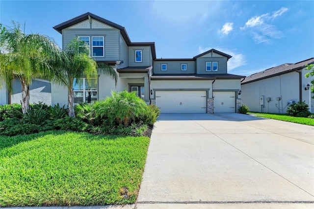 13071 Willow Grove Dr, Riverview, FL 33579 - view of front of home featuring a front lawn, stucco siding, stone siding, and concrete driveway
