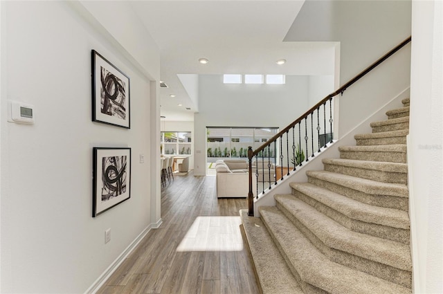 13071 Willow Grove Dr, Riverview, FL 33579 - entrance foyer featuring baseboards, recessed lighting, wood finished floors, and stairway