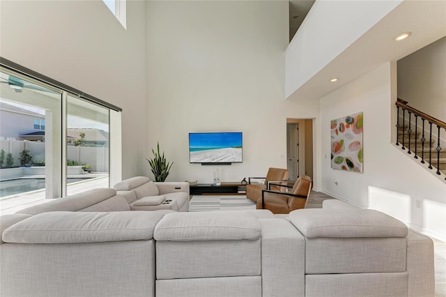 13071 Willow Grove Dr, Riverview, FL 33579 - living room with recessed lighting, baseboards, a high ceiling, and stairway