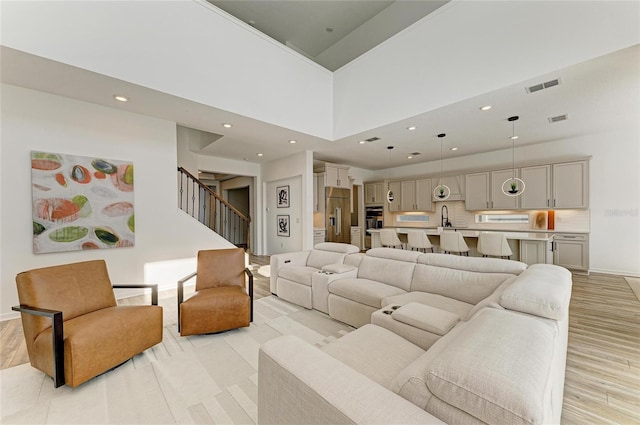 13071 Willow Grove Dr, Riverview, FL 33579 - living area with recessed lighting, visible vents, and light wood finished floors