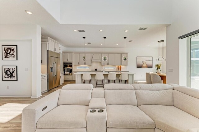 13071 Willow Grove Dr, Riverview, FL 33579 - living area with visible vents, recessed lighting, light wood-style floors, and baseboards