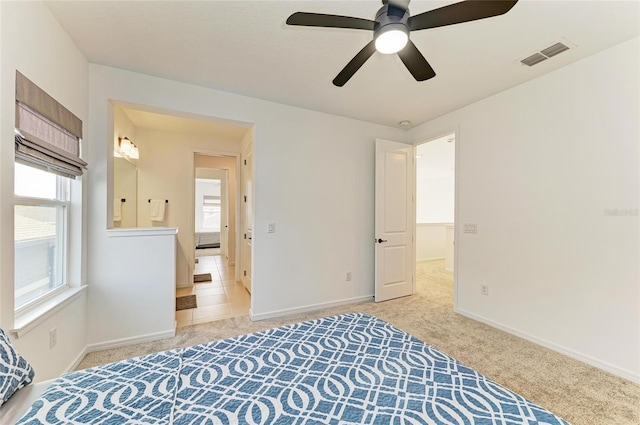 13071 Willow Grove Dr, Riverview, FL 33579 - bedroom with visible vents, baseboards, ceiling fan, and light carpet