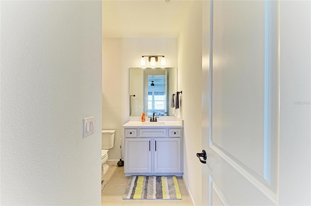 13071 Willow Grove Dr, Riverview, FL 33579 - bathroom featuring vanity, baseboards, tile patterned floors, and toilet