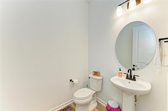 13071 Willow Grove Dr, Riverview, FL 33579 - bathroom with toilet, baseboards, and wood finished floors