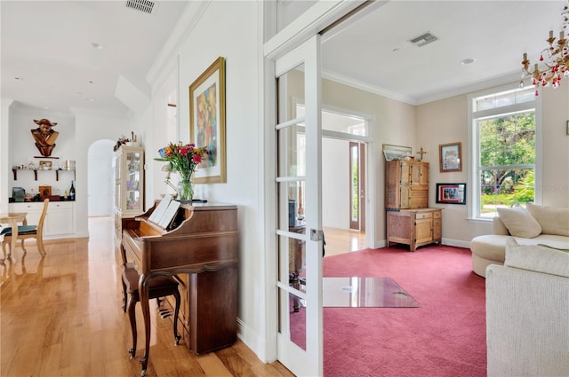 16470 Oakview Cir, Alva, FL 33920 - interior space featuring visible vents, baseboards, ornamental molding, and light wood-style floors