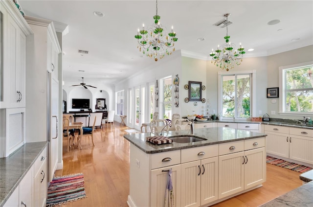16470 Oakview Cir, Alva, FL 33920 - kitchen featuring open floor plan, light wood-style floors, visible vents, and ceiling fan with notable chandelier