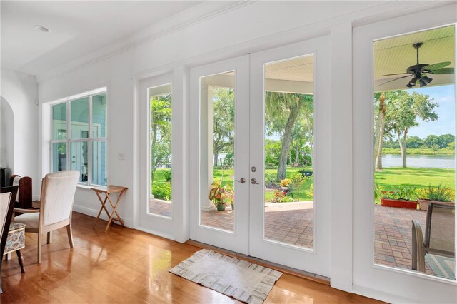 16470 Oakview Cir, Alva, FL 33920 - doorway to outside with arched walkways, a water view, french doors, and plenty of natural light