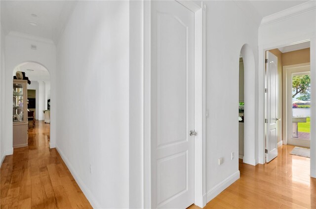 16470 Oakview Cir, Alva, FL 33920 - corridor featuring light wood-style floors, baseboards, ornamental molding, and arched walkways