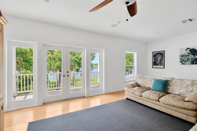 16470 Oakview Cir, Alva, FL 33920 - living room featuring visible vents, a ceiling fan, french doors, and light wood finished floors