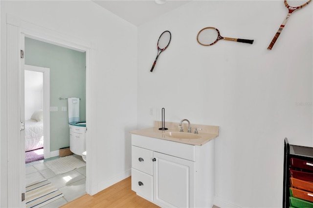 16470 Oakview Cir, Alva, FL 33920 - bathroom with toilet, vanity, and baseboards