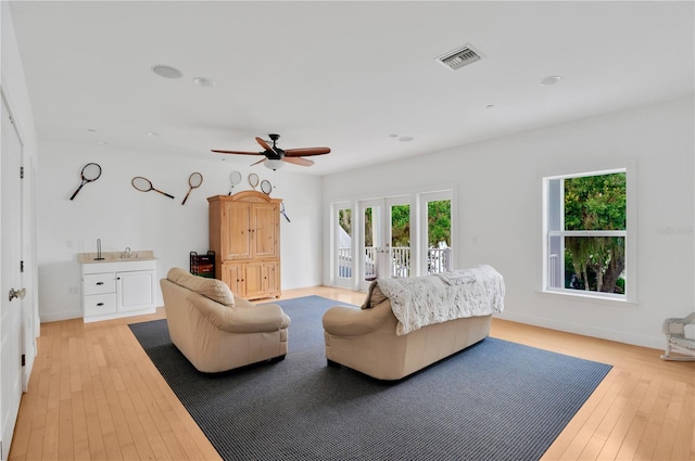 16470 Oakview Cir, Alva, FL 33920 - interior space with baseboards, visible vents, access to exterior, and light wood-style flooring