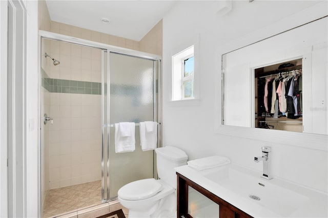 16470 Oakview Cir, Alva, FL 33920 - bathroom with a spacious closet, a stall shower, toilet, and vanity
