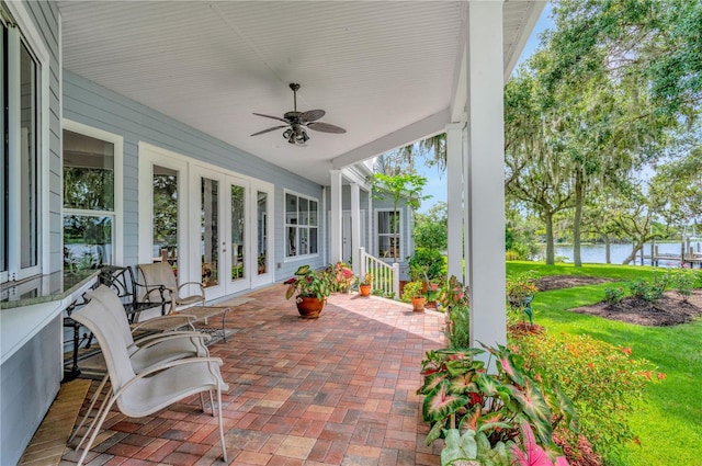 16470 Oakview Cir, Alva, FL 33920 - sunroom featuring a ceiling fan, a water view, french doors, and brick floor