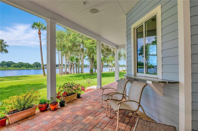 16470 Oakview Cir, Alva, FL 33920 - view of patio / terrace with a porch and a water view