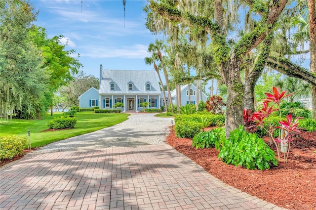 16470 Oakview Cir, Alva, FL 33920 - view of front of house with covered porch, decorative driveway, and a front yard