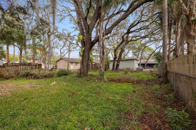 view of yard with a fenced backyard