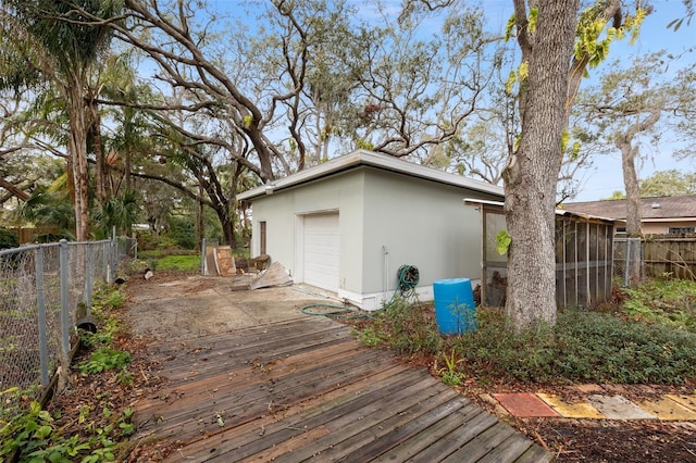 wooden deck featuring fence and a sunroom