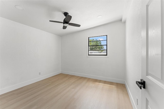 unfurnished room with baseboards, a ceiling fan, and light wood finished floors