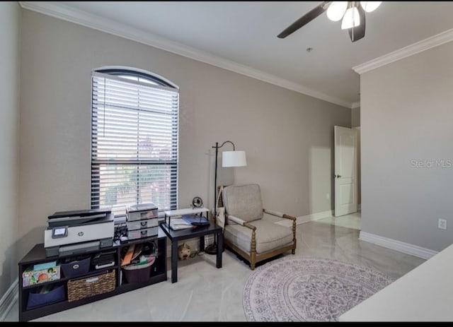 living area featuring baseboards, ornamental molding, and ceiling fan