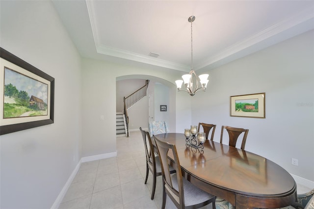11909 Climbing Fern Ave, Riverview, FL 33579 - dining room with stairway, a notable chandelier, crown molding, baseboards, and arched walkways