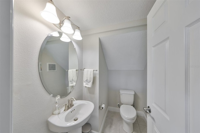 11909 Climbing Fern Ave, Riverview, FL 33579 - half bathroom with a textured ceiling, a sink, visible vents, toilet, and tile patterned floors