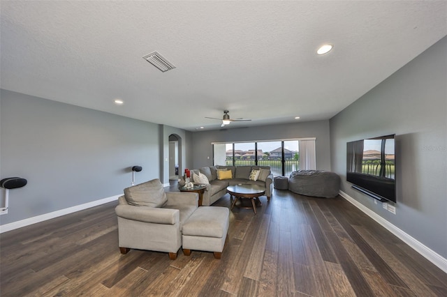 11909 Climbing Fern Ave, Riverview, FL 33579 - living area with visible vents, ceiling fan, baseboards, arched walkways, and wood finished floors