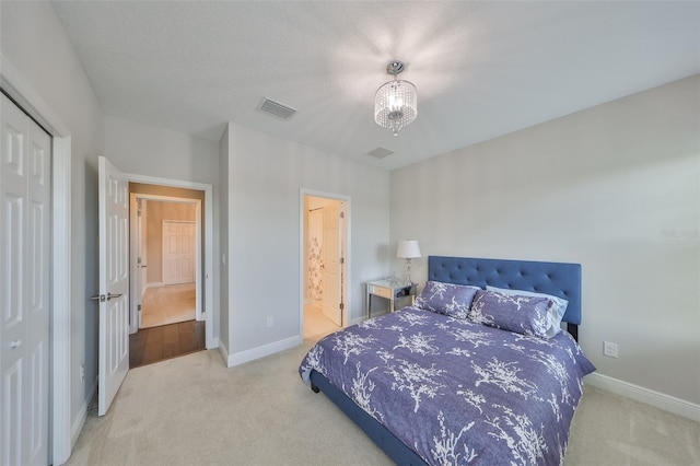 11909 Climbing Fern Ave, Riverview, FL 33579 - bedroom featuring a closet, carpet flooring, baseboards, visible vents, and a notable chandelier