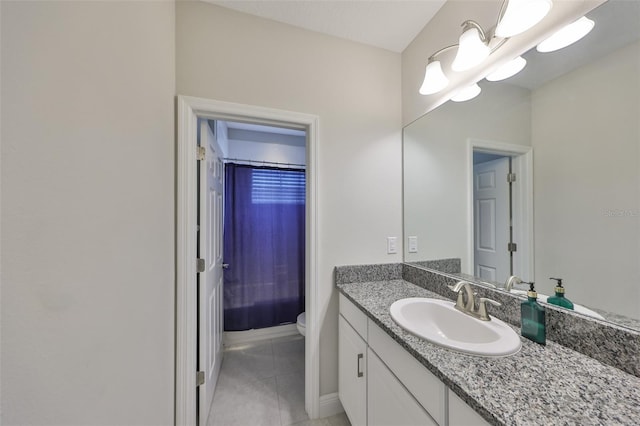 11909 Climbing Fern Ave, Riverview, FL 33579 - bathroom featuring toilet, tile patterned flooring, vanity, and baseboards