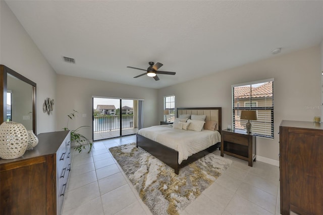 11909 Climbing Fern Ave, Riverview, FL 33579 - bedroom featuring light tile patterned floors, visible vents, ceiling fan, and access to exterior