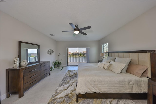11909 Climbing Fern Ave, Riverview, FL 33579 - bedroom with light tile patterned flooring, access to exterior, visible vents, a ceiling fan, and baseboards