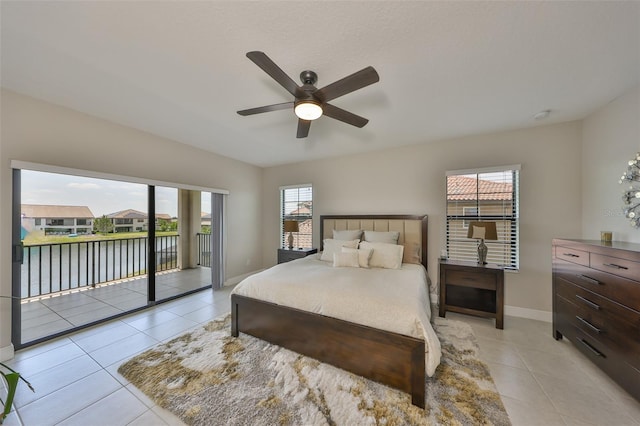 11909 Climbing Fern Ave, Riverview, FL 33579 - bedroom featuring light tile patterned flooring, access to exterior, a water view, and baseboards