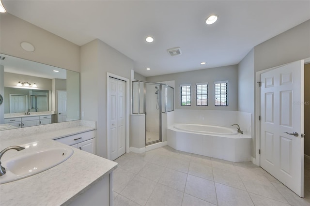 11909 Climbing Fern Ave, Riverview, FL 33579 - bathroom with recessed lighting, tile patterned flooring, a shower stall, a bath, and vanity