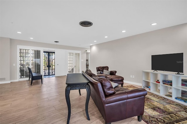 307 Orangewood Ln, Largo, FL 33770 - living area with visible vents, recessed lighting, light wood-style floors, and baseboards