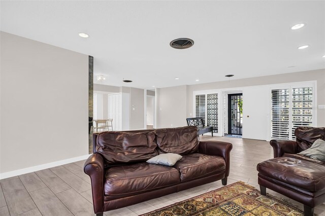 307 Orangewood Ln, Largo, FL 33770 - living room featuring recessed lighting, visible vents, and wood finished floors
