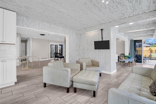 307 Orangewood Ln, Largo, FL 33770 - living room featuring baseboards, wood tiled floor, visible vents, and wooden ceiling