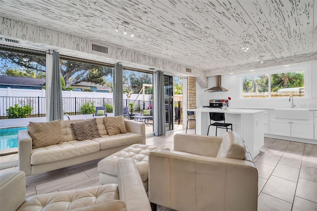 307 Orangewood Ln, Largo, FL 33770 - sunroom with visible vents and a sink