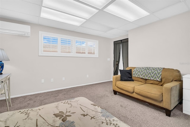 307 Orangewood Ln, Largo, FL 33770 - carpeted living area with baseboards, a wall unit AC, and a drop ceiling