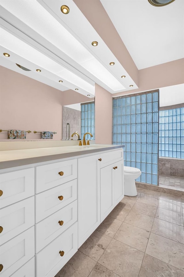 307 Orangewood Ln, Largo, FL 33770 - bathroom with recessed lighting, vanity, tile patterned flooring, and toilet