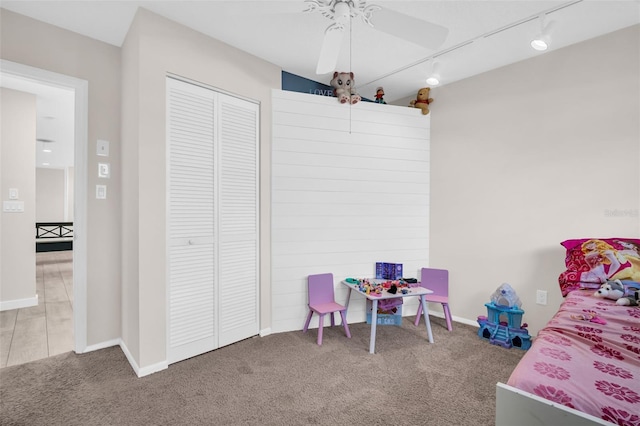 307 Orangewood Ln, Largo, FL 33770 - bedroom featuring track lighting, baseboards, carpet, and a closet